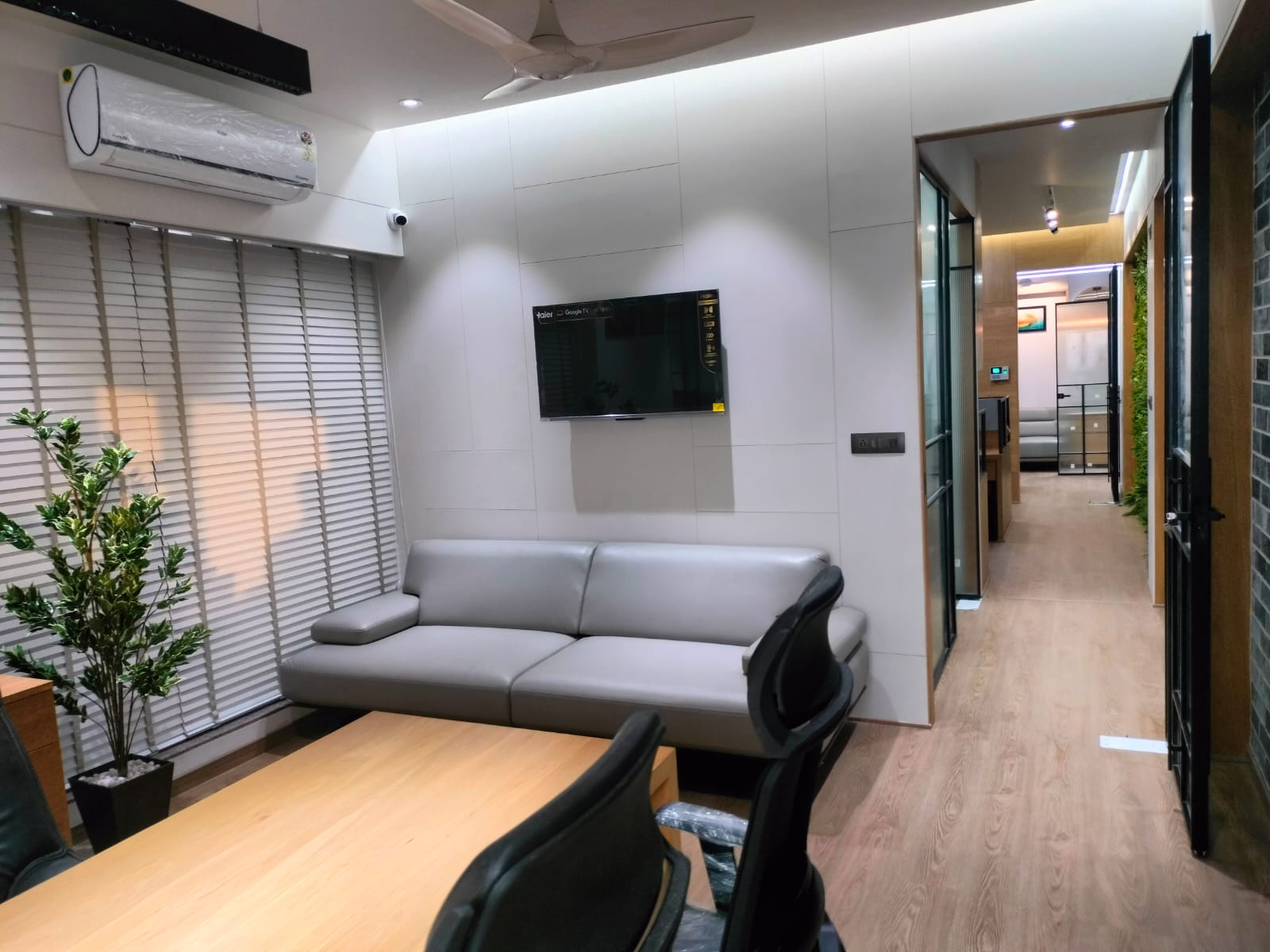 Office lounge with TV and meeting table