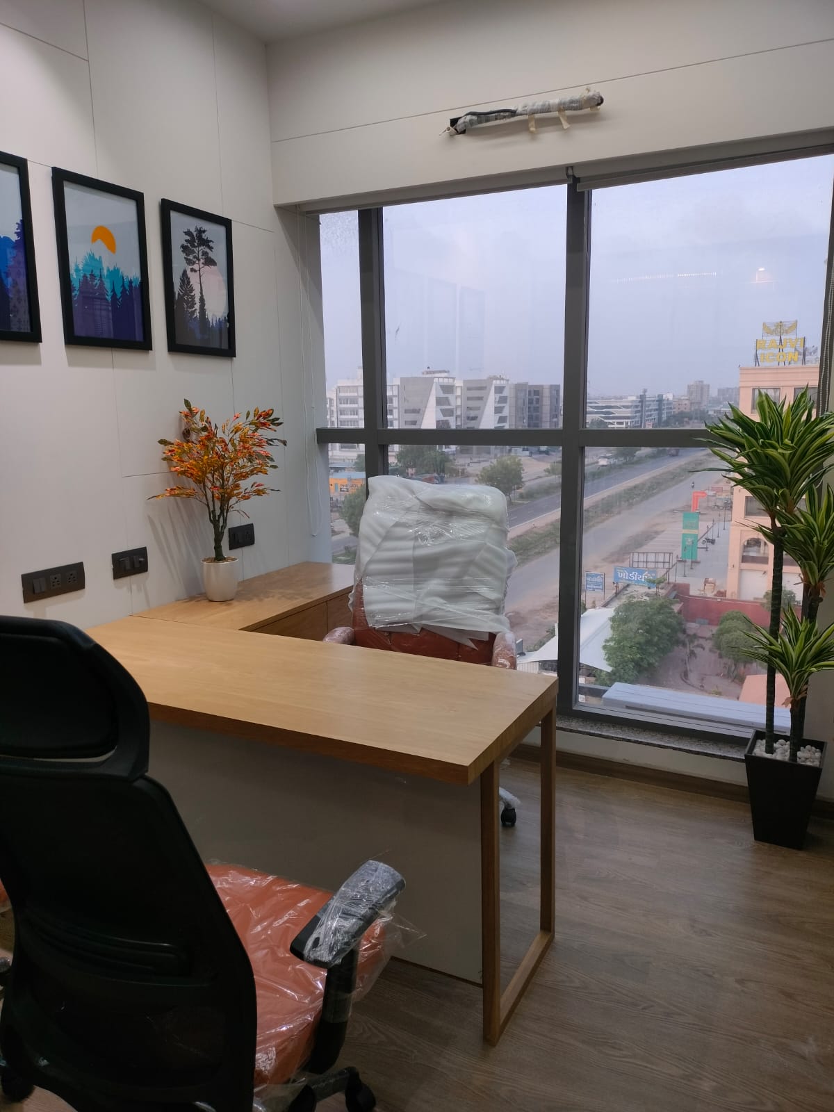 Engineer workspace by the window